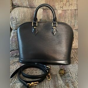 Louis Vuitton black  Alma PM with adjustable strap, lock and key.